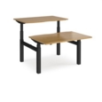 Elev8 Touch sit-stand back-to-back desks 1200mm x 1650mm - black frame and oak top