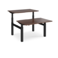 Elev8 Touch sit-stand back-to-back desks 1200mm x 1650mm - black frame and walnut top