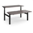 Elev8 Touch sit-stand back-to-back desks 1600mm x 1650mm - black frame and grey oak top
