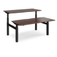 Elev8 Touch sit-stand back-to-back desks 1600mm x 1650mm - black frame and walnut top