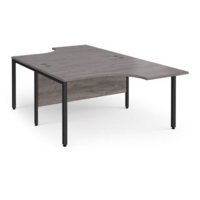 Maestro 25 back to back ergonomic desks 1400mm deep - black bench leg frame and grey oak top