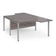 Maestro 25 back to back ergonomic desks 1400mm deep - silver bench leg frame and grey oak top
