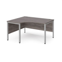 Maestro 25 left hand ergonomic desk 1400mm wide - silver bench leg frame and grey oak top