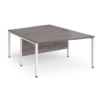 Maestro 25 back to back wave desks 1400mm deep - white bench leg frame and grey oak top