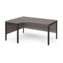 Maestro 25 left hand ergonomic desk 1600mm wide - black bench leg frame and grey oak top
