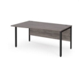 Maestro 25 left hand wave desk 1600mm wide - black bench leg frame and grey oak top