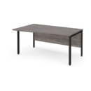 Maestro 25 left hand wave desk 1600mm wide - black bench leg frame and grey oak top