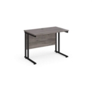 Maestro 25 straight desk 1000mm x 600mm - black cantilever leg frame and grey oak top