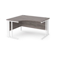 Maestro 25 left hand ergonomic desk 1400mm wide - white cable managed leg frame and grey oak top